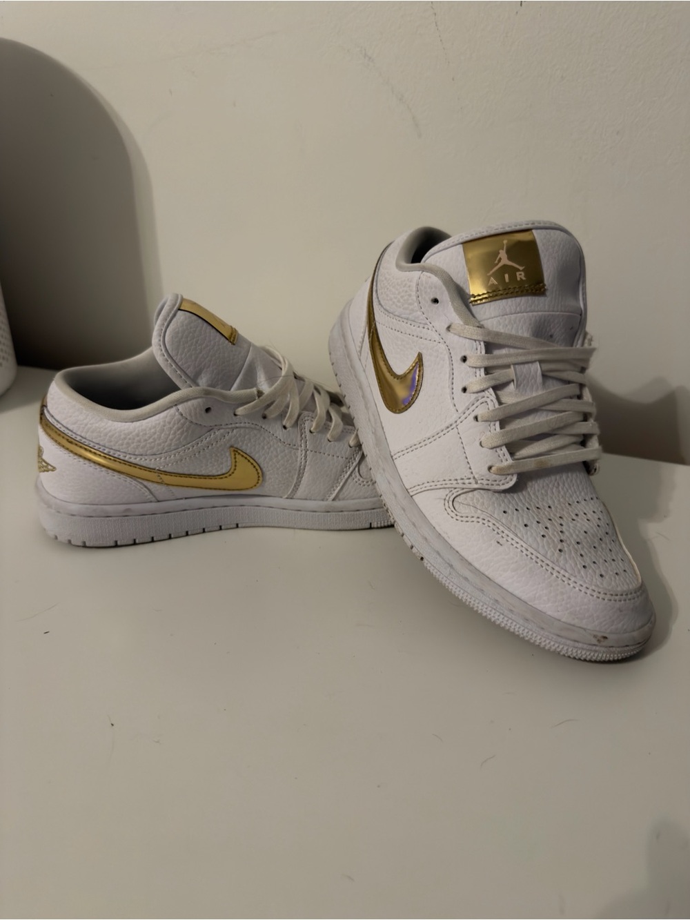 Nike Air Jordan 1 Low Women's Sneakers in White with Gold Swoosh